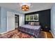 Cozy bedroom featuring closet storage, natural light and a patterned rug at 6340 Monitor Ln, Indianapolis, IN 46220