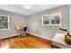 Bright bedroom with wood floors, natural light and drawing table, perfect for creative pursuits at 6340 Monitor Ln, Indianapolis, IN 46220