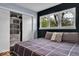 Charming bedroom with closet storage, natural light and a patterned rug at 6340 Monitor Ln, Indianapolis, IN 46220
