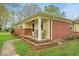 Inviting brick front porch with stylish chairs, perfect for relaxing outdoors at 6340 Monitor Ln, Indianapolis, IN 46220
