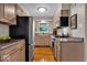Galley kitchen with stainless steel appliances and hardwood floors at 6340 Monitor Ln, Indianapolis, IN 46220