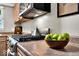 Updated kitchen featuring gas range, wooden cabinets, and granite countertops for a modern cooking experience at 6340 Monitor Ln, Indianapolis, IN 46220