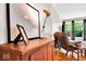 Close up of stylish living room, featuring leather chair, console table and a modern lamp at 6340 Monitor Ln, Indianapolis, IN 46220