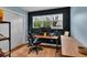 Bright office featuring wooden floors, natural light, modern desk and rolling chair at 6340 Monitor Ln, Indianapolis, IN 46220