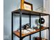 Stylish shelf with books, camera and geometric design, adding personality to the space at 6340 Monitor Ln, Indianapolis, IN 46220