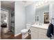 Clean bathroom featuring a single sink vanity, toilet, and shower with a curtain at 6373 Thornridge Dr, Avon, IN 46123