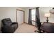 Cozy bedroom with comfortable seating, ample natural light, and a neutral color palette at 6373 Thornridge Dr, Avon, IN 46123