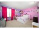 A cheerful bedroom in bright purple and pink pastels with a plush rug at 6373 Thornridge Dr, Avon, IN 46123