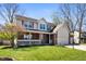 Charming two-story home with brick facade, well-manicured lawn, and attached two car garage at 6373 Thornridge Dr, Avon, IN 46123
