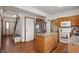 Modern kitchen with island, stainless steel appliances, and seamless transition to other living spaces at 6373 Thornridge Dr, Avon, IN 46123