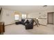 Comfortable loft area featuring a sectional sofa, recliner, and natural light at 6373 Thornridge Dr, Avon, IN 46123