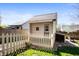 A backyard shed with a small white picket fence around it at 6373 Thornridge Dr, Avon, IN 46123