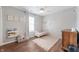 Bright bedroom features natural light, hardwood floors, and neutral paint colors at 6459 Titania Dr, Indianapolis, IN 46236