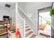Bright entryway showcases staircase with white railings and decorative window at 6459 Titania Dr, Indianapolis, IN 46236