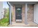 Inviting front door features decorative wreath, sidelight window, and 'Welcome' message at 6459 Titania Dr, Indianapolis, IN 46236