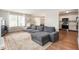 Open-concept living room features neutral paint, large windows, and comfortable seating at 6459 Titania Dr, Indianapolis, IN 46236