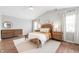 This large main bedroom features a vaulted ceiling, natural light, and a neutral color palette at 6459 Titania Dr, Indianapolis, IN 46236