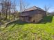 Backyard featuring a wooden deck, green lawn and mature trees at 6618 Crystal Springs Dr, Avon, IN 46123