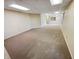 Finished basement with neutral carpet and plenty of open space at 6618 Crystal Springs Dr, Avon, IN 46123