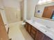 Bright bathroom with a double sink vanity and a shower-tub combo at 6618 Crystal Springs Dr, Avon, IN 46123