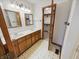Bathroom with a double sink vanity and access to a walk-in closet at 6618 Crystal Springs Dr, Avon, IN 46123