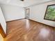 A spacious bedroom with wood floors and a window view of the outdoors at 6618 Crystal Springs Dr, Avon, IN 46123