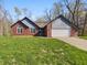 Charming single-Gathering home with brick facade, attached garage, and a well-manicured lawn at 6618 Crystal Springs Dr, Avon, IN 46123