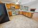 Updated kitchen with stainless steel appliances, tile floors and hardwood cabinets at 6618 Crystal Springs Dr, Avon, IN 46123