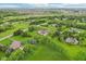 Majestic aerial view of a home showcasing lush landscaping and scenic surroundings at 6990 Old Hunt Club Rd, Zionsville, IN 46077