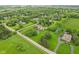 Stunning aerial view of an estate showcasing the lush landscaping and tranquil setting at 6990 Old Hunt Club Rd, Zionsville, IN 46077