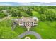 Estate home with backyard pool, porte cochere, and lush landscaping at 6990 Old Hunt Club Rd, Zionsville, IN 46077