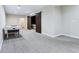 Finished basement with gray carpet, air hockey table, and barn doors to a hidden room at 6990 Old Hunt Club Rd, Zionsville, IN 46077
