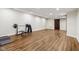 Spacious basement featuring an exercise area and wood-look flooring at 6990 Old Hunt Club Rd, Zionsville, IN 46077