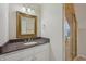 A bathroom featuring granite countertops, white cabinets, gold hardware, and a glass shower door at 6990 Old Hunt Club Rd, Zionsville, IN 46077