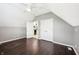 A bedroom provides closet space and an open door leads into a space with dark kitchen cabinets at 6990 Old Hunt Club Rd, Zionsville, IN 46077