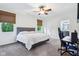 Bright bedroom with neutral decor, a computer setup, and a view of the outdoors at 6990 Old Hunt Club Rd, Zionsville, IN 46077