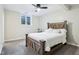 Charming bedroom with a rustic wood bed frame and soft, neutral carpet at 6990 Old Hunt Club Rd, Zionsville, IN 46077