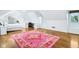 Cozy bedroom with large pink rug and lots of sunlight at 6990 Old Hunt Club Rd, Zionsville, IN 46077
