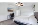 Bedroom features neutral decor, a computer setup, and TV at 6990 Old Hunt Club Rd, Zionsville, IN 46077