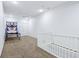 Bonus room with stairs, an air hockey game, and neutral carpet at 6990 Old Hunt Club Rd, Zionsville, IN 46077