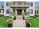 Beautiful home entrance featuring a double door entry and manicured landscaping at 6990 Old Hunt Club Rd, Zionsville, IN 46077
