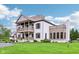 Elegant two-story home featuring a spacious front yard with green landscaping at 6990 Old Hunt Club Rd, Zionsville, IN 46077