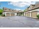 Spacious garage with multiple bays and an expansive asphalt driveway at 6990 Old Hunt Club Rd, Zionsville, IN 46077