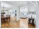 Bright open-concept living space showcasing hardwood floors, dining room, and a living room with fireplace at 6990 Old Hunt Club Rd, Zionsville, IN 46077