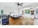 Spacious main bedroom with hard wood floors, fireplace, and plenty of windows at 6990 Old Hunt Club Rd, Zionsville, IN 46077