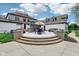 Spacious outdoor patio with multiple seating areas and a hot tub at 6990 Old Hunt Club Rd, Zionsville, IN 46077