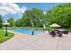 A gorgeous pool with patio seating and lounge chairs at 6990 Old Hunt Club Rd, Zionsville, IN 46077