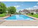 In-ground pool surrounded by an expansive patio and well-manicured grounds at 6990 Old Hunt Club Rd, Zionsville, IN 46077