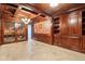 Custom wine room with wood trim and tile flooring, including individual racks to store wine bottles at 6990 Old Hunt Club Rd, Zionsville, IN 46077
