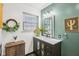 Bathroom showcasing a stylish vanity with green walls and attractive decor at 709 S Meridian St, Lebanon, IN 46052